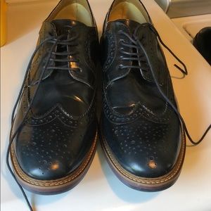 Leather wingtip style men’s dress shoes